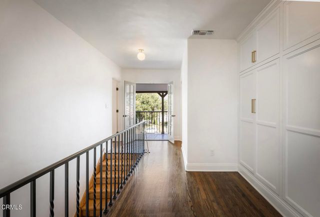 a view of a balcony with chairs