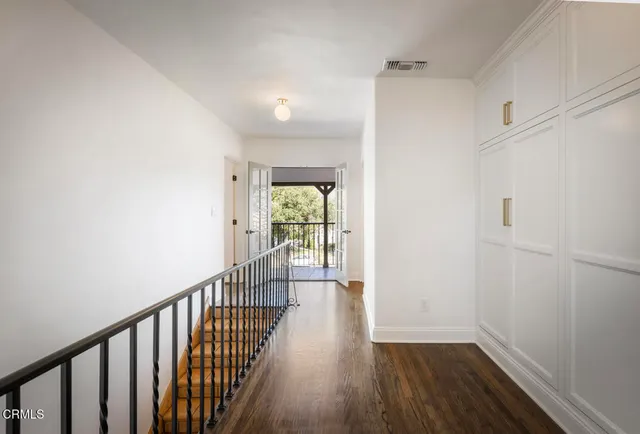 a view of a balcony with chairs