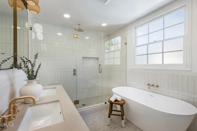 a bathroom with a sink mirror and toilet