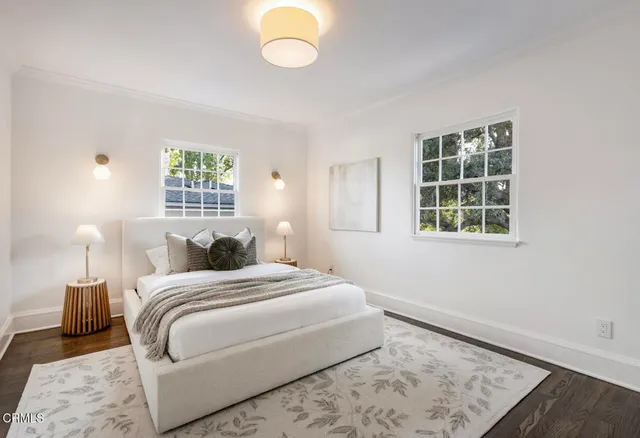 a building outdoor space with patio furniture and potted plants