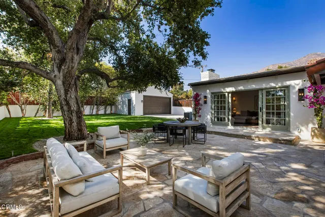 a outdoor space with patio furniture and windows
