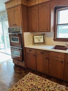 10119 Littlefield Road Charlotte, NC 28214 - Photo 6 of 8 a kitchen with stainless steel appliances granite countertop a stove a sink and a microwave