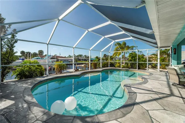 a view of a swimming pool with a patio