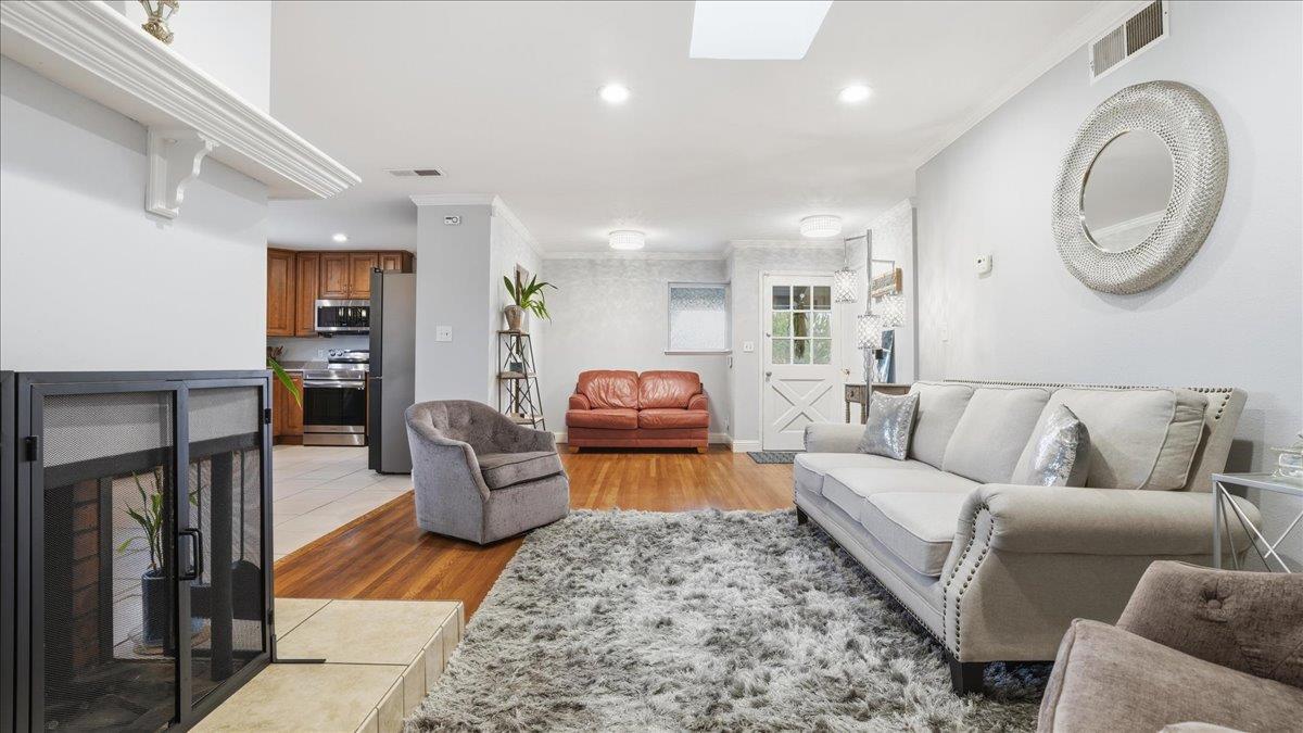 a living room with furniture and a fireplace