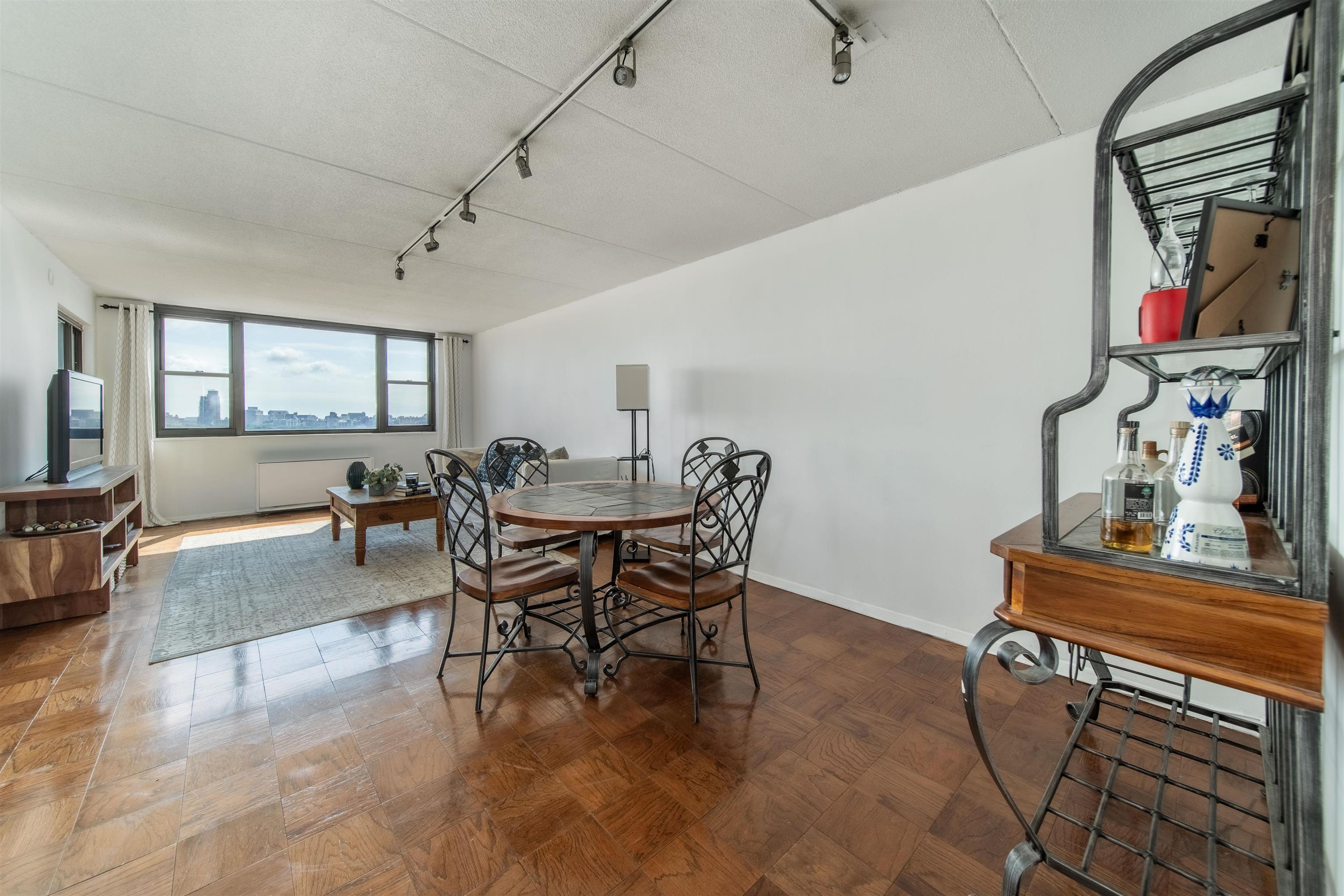 250 Gorge Road, Unit 12K Cliffside Park, NJ 07010 - Photo 3 of 18 a view of a dining room with furniture