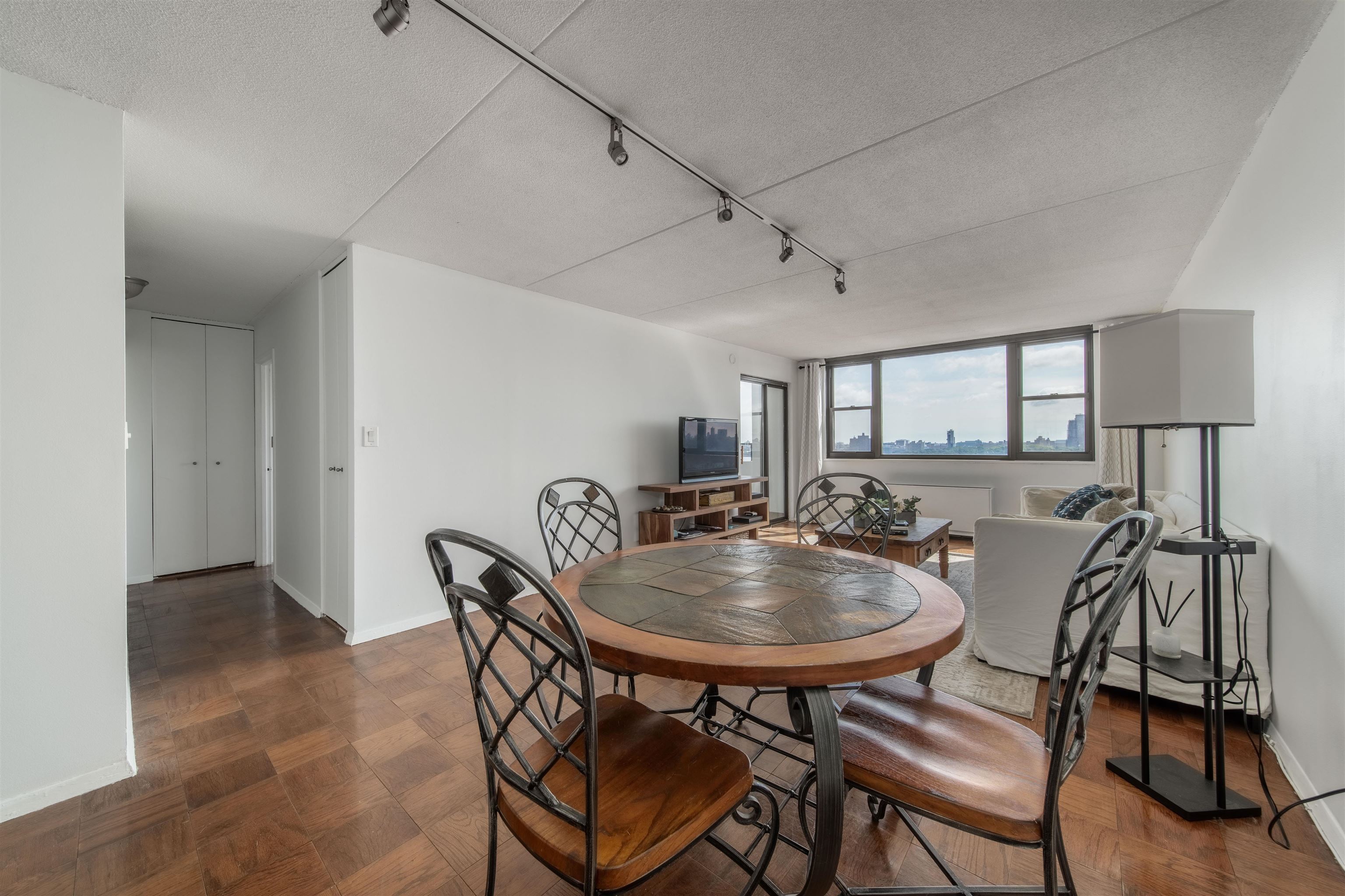 250 Gorge Road, Unit 12K Cliffside Park, NJ 07010 - Photo 4 of 18 a view of a dining room with furniture and wooden floor