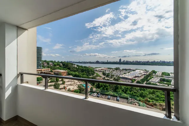 a view of a balcony with city view