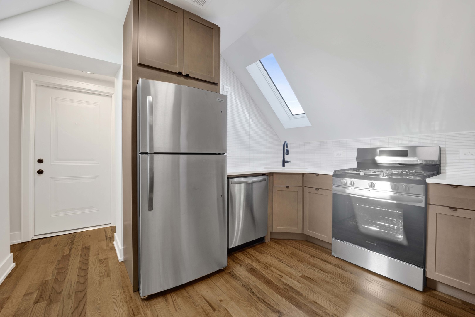 3300 West Pershing Road, Unit GR Chicago, IL 60632 - Photo 5 of 11 a kitchen with a refrigerator sink and cabinets