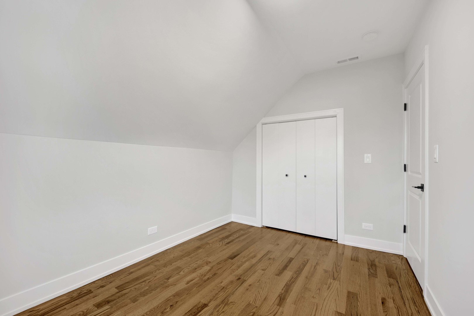 3300 West Pershing Road, Unit GR Chicago, IL 60632 - Photo 9 of 11 a view of empty room with wooden floor