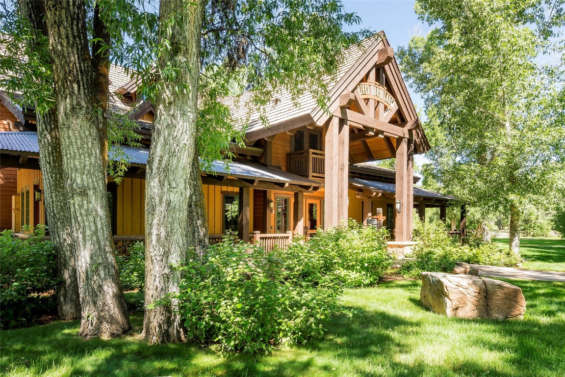 27200 Fire Song Road Steamboat Springs, CO 80487 - Photo 23 of 30 a view of a house with a yard