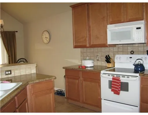 a room with a sink cabinets and utility