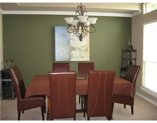 a view of a dining room with furniture and window