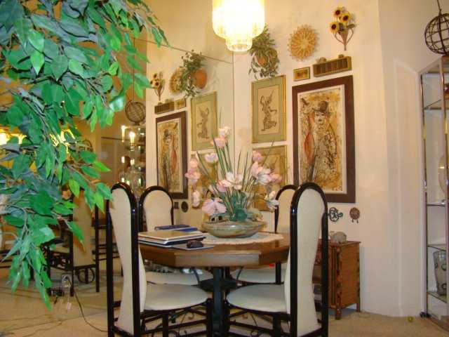 9609 Riverside Drive, Unit 9 Coral Springs, FL 33071 - Photo 12 of 15 a view of a dining room with furniture and chandelier