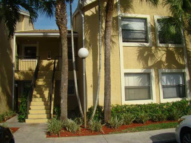 9609 Riverside Drive, Unit 9 Coral Springs, FL 33071 - Photo 14 of 15 a front view of a house with a yard