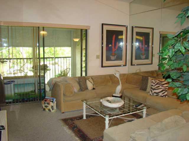9609 Riverside Drive, Unit 9 Coral Springs, FL 33071 - Photo 4 of 15 a living room with furniture and a window