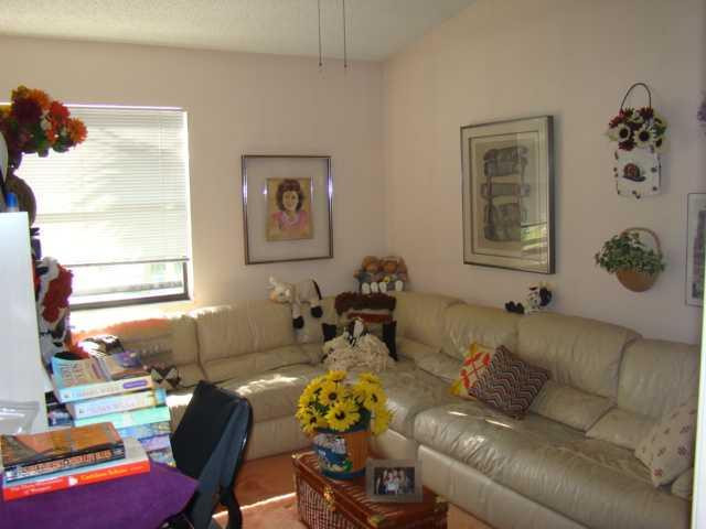 9609 Riverside Drive, Unit 9 Coral Springs, FL 33071 - Photo 5 of 15 a living room with furniture and a window