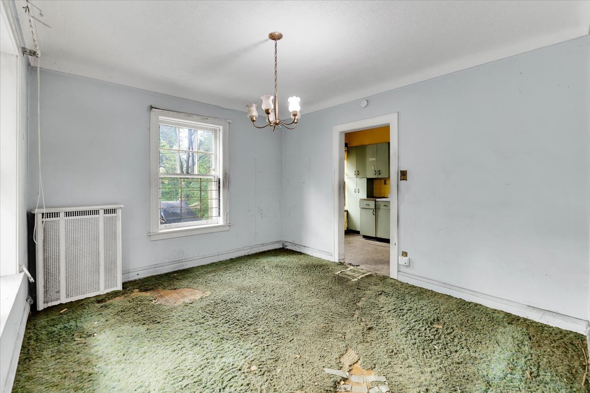 1704 West 94th Street Chicago, IL 60643 - Photo 14 of 29 an empty room with chandelier fan and windows