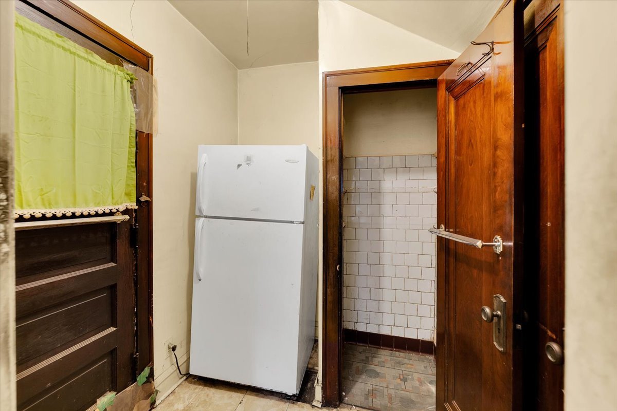 1704 West 94th Street Chicago, IL 60643 - Photo 16 of 29 a view of storage and utility room with washer and dryer