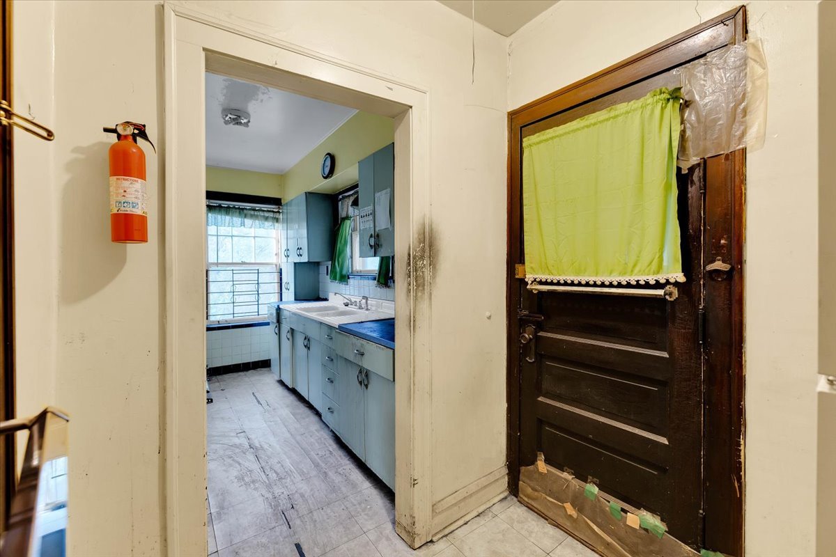 1704 West 94th Street Chicago, IL 60643 - Photo 17 of 29 a kitchen with a refrigerator and a sink