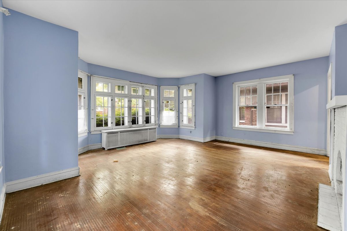 1704 West 94th Street Chicago, IL 60643 - Photo 2 of 29 wooden floor in an empty room with a window