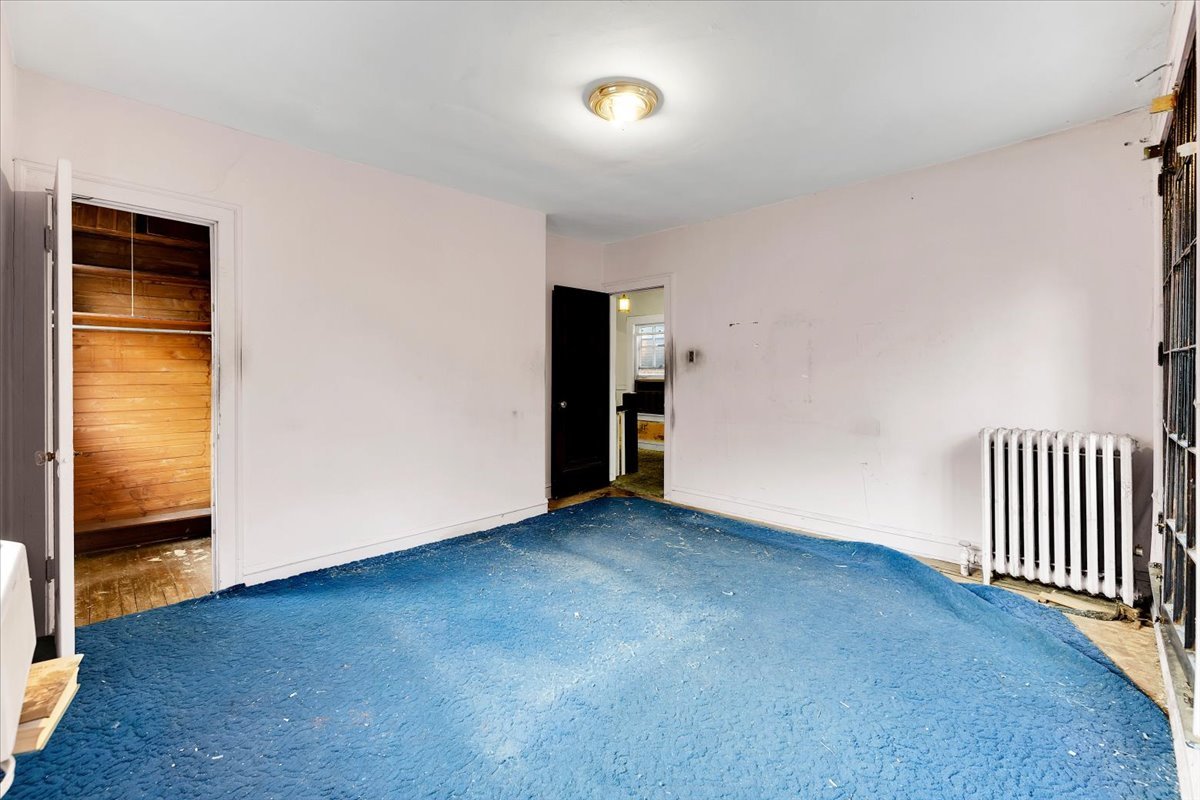 1704 West 94th Street Chicago, IL 60643 - Photo 24 of 29 a view of an empty room with wooden floor and a window