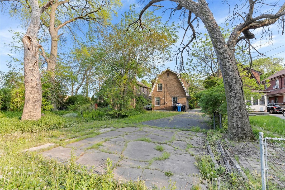 1704 West 94th Street Chicago, IL 60643 - Photo 27 of 29 a backyard of a house with lots of green space