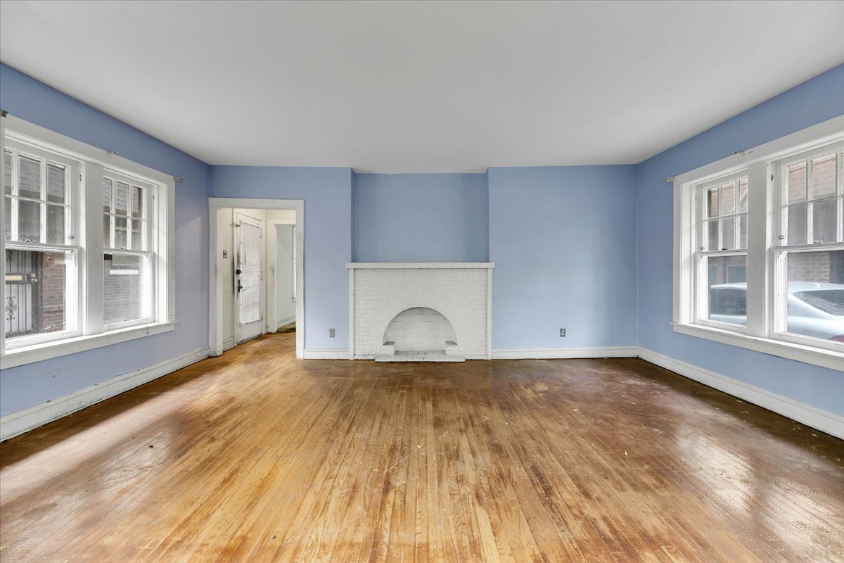 1704 West 94th Street Chicago, IL 60643 - Photo 3 of 29 a view of empty room with wooden floor and fan