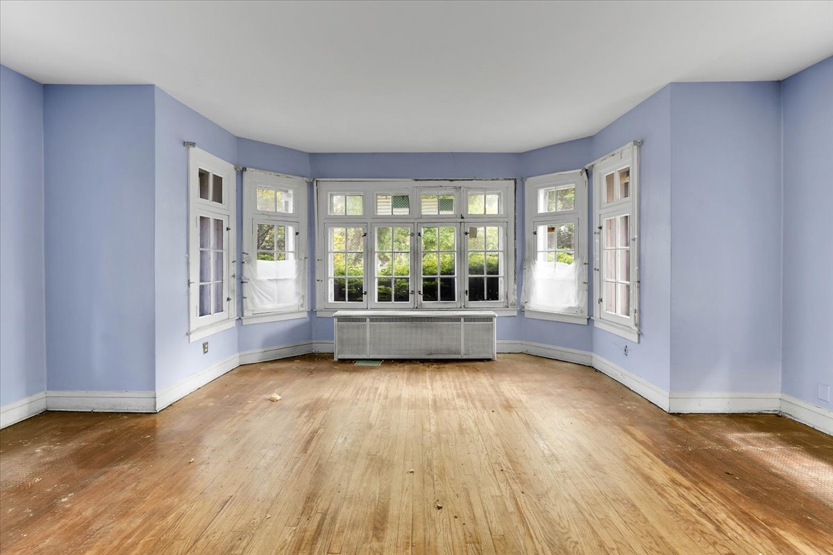 1704 West 94th Street Chicago, IL 60643 - Photo 4 of 29 a view of a big room with wooden floor and windows
