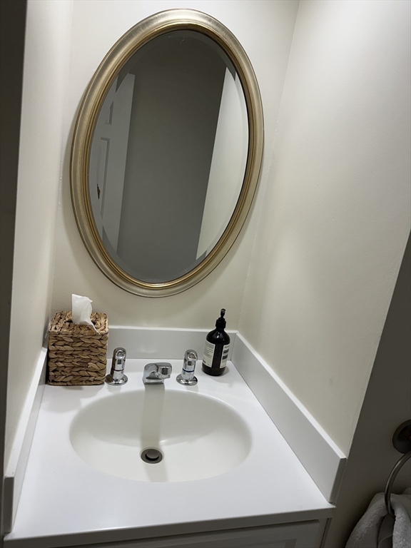 45 Wellesley Road Belmont, MA 02478 - Photo 30 of 39 a bathroom with a sink and a mirror