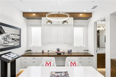 a view of a balcony with two chairs