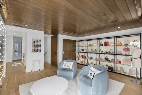 a storage room with cabinets and wooden floor