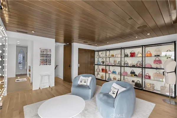 a storage room with cabinets and wooden floor