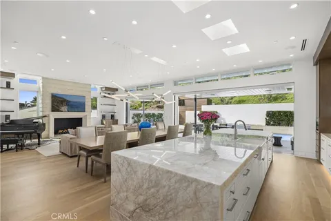 a kitchen with stainless steel appliances kitchen island granite countertop a stove a sink and a microwave