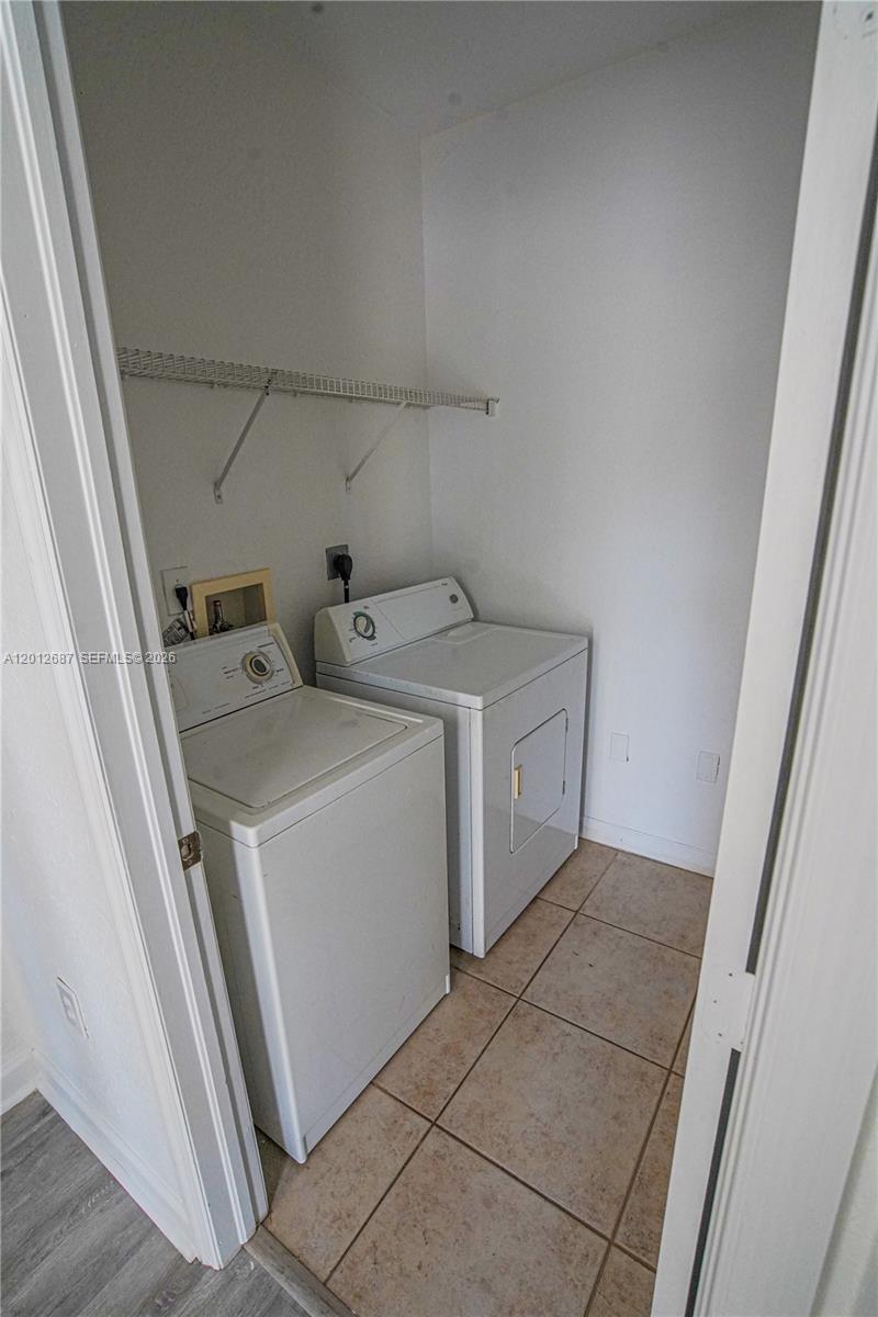 1751 Southwest 154th Path Miami, FL 33185 - Photo 12 of 41 a utility room with dryer and washer