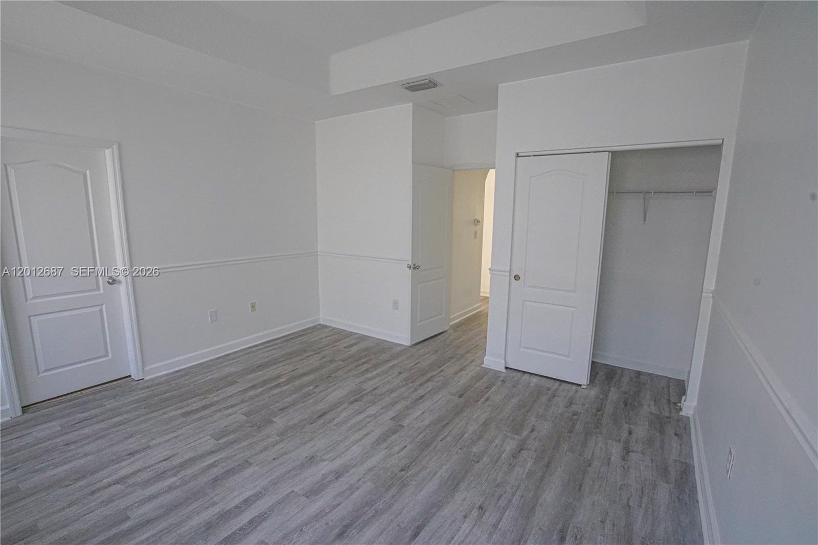 1751 Southwest 154th Path Miami, FL 33185 - Photo 16 of 41 an empty room with wooden floor