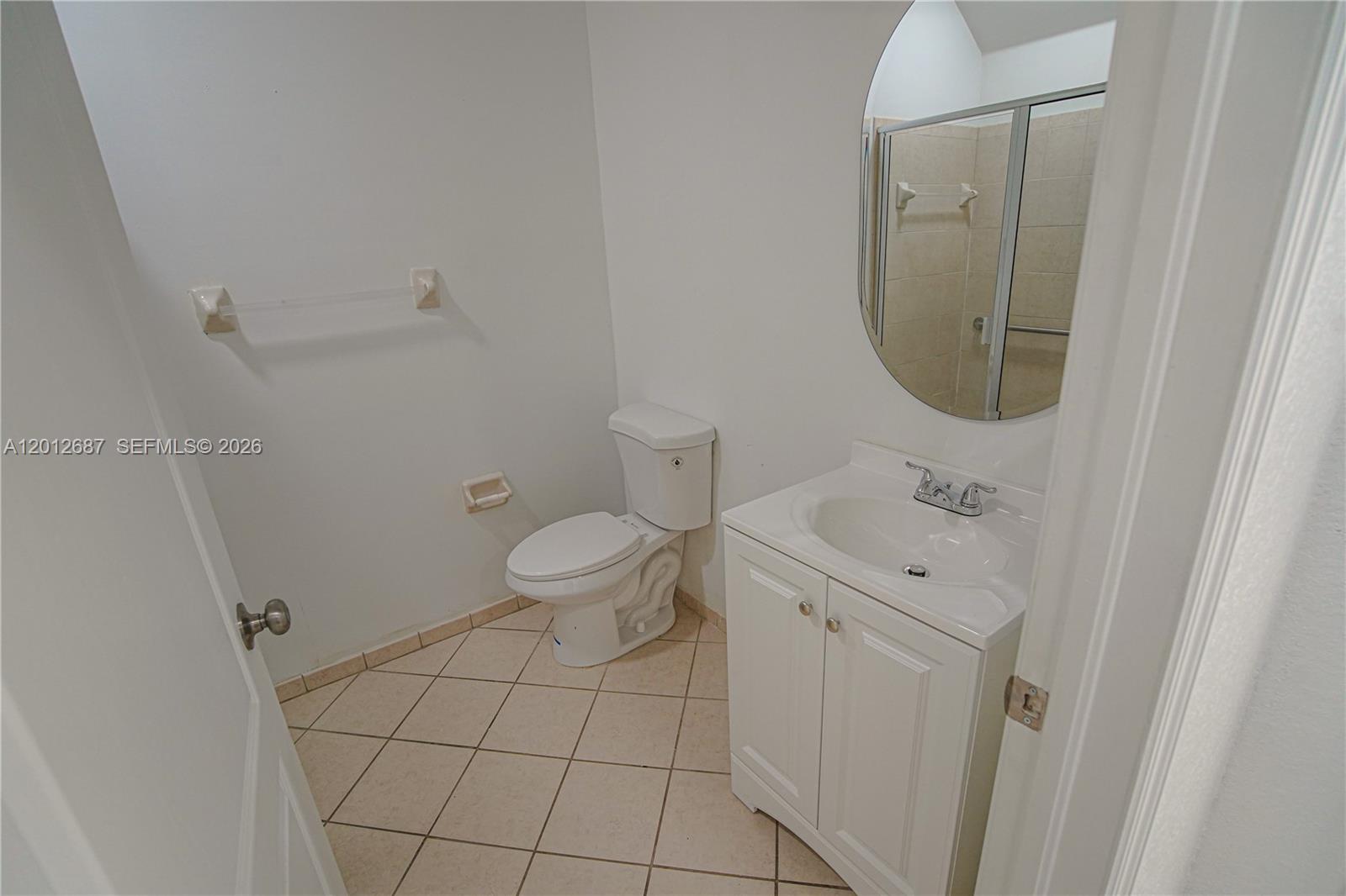 1751 Southwest 154th Path Miami, FL 33185 - Photo 25 of 41 a bathroom with a toilet and a sink