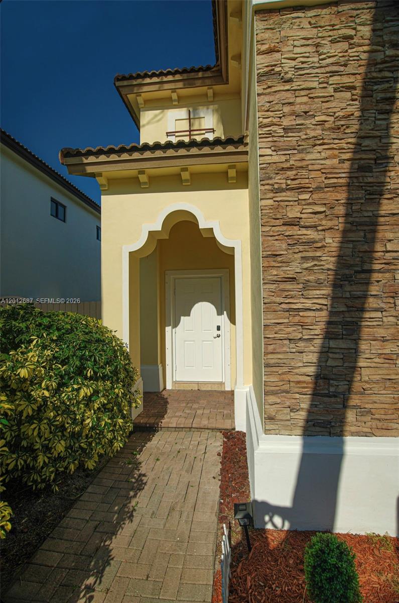 1751 Southwest 154th Path Miami, FL 33185 - Photo 3 of 41 a front view of a house with a yard