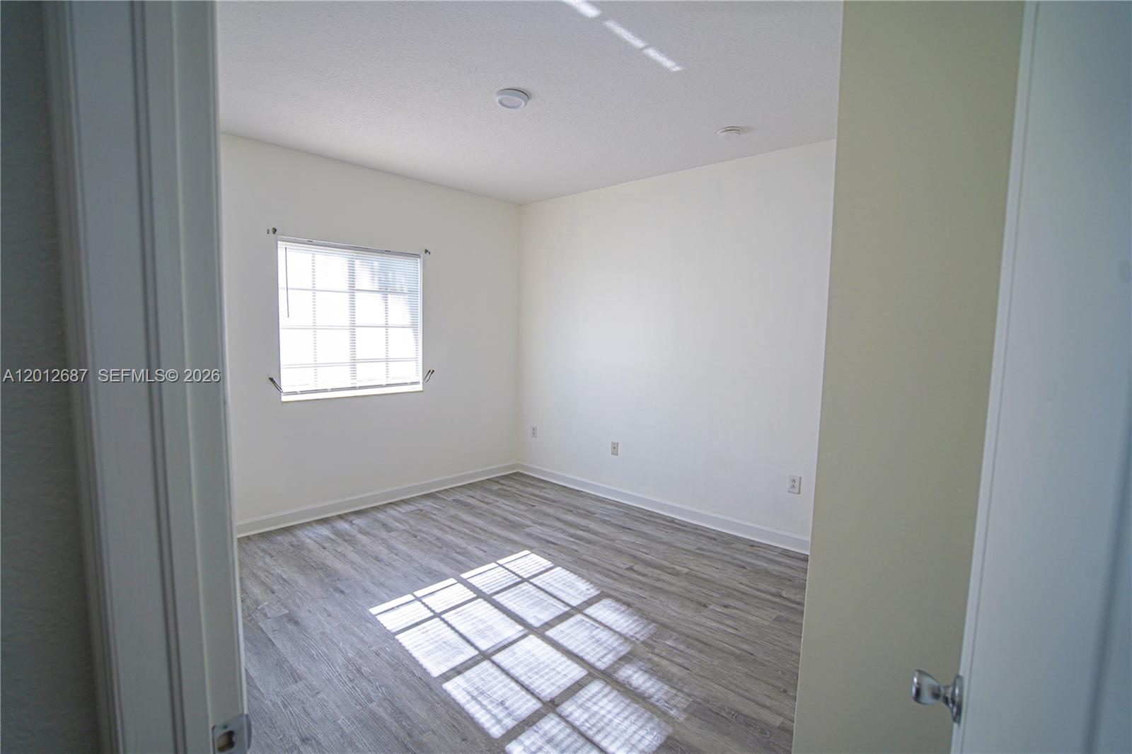 1751 Southwest 154th Path Miami, FL 33185 - Photo 32 of 41 an empty room with windows