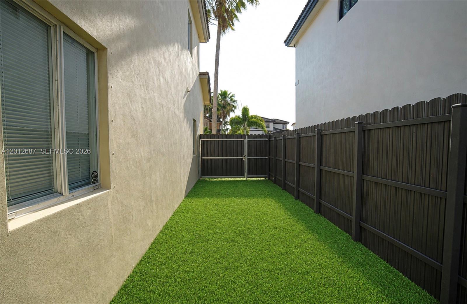 1751 Southwest 154th Path Miami, FL 33185 - Photo 41 of 41 a view of a backyard with potted plants