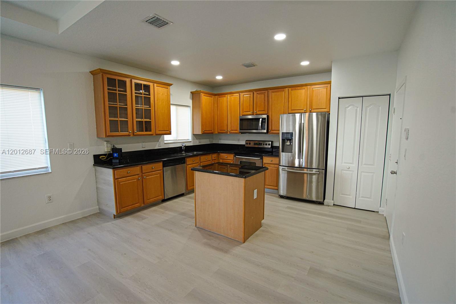 1751 Southwest 154th Path Miami, FL 33185 - Photo 6 of 41 a kitchen with stainless steel appliances granite countertop a stove a sink and a refrigerator