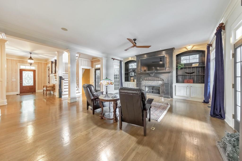 3901 Hazelhurst Drive Northeast Marietta, GA 30066 - Photo 18 of 79 a view of a livingroom with furniture wooden floor and a fireplace