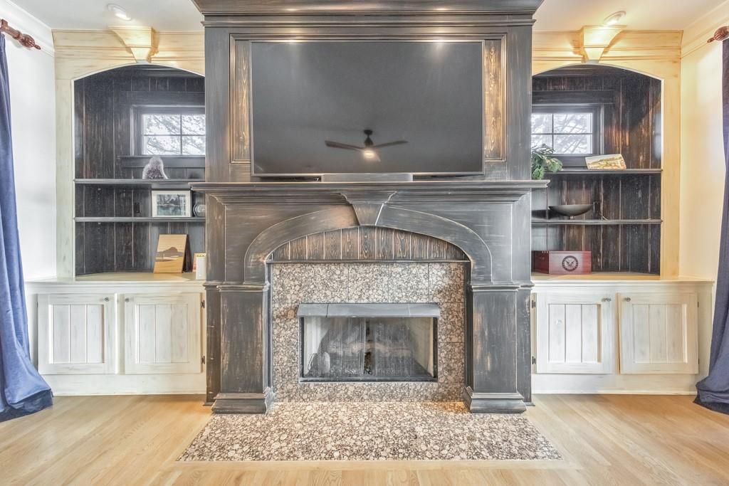 3901 Hazelhurst Drive Northeast Marietta, GA 30066 - Photo 20 of 79 a living room with a fireplace windows a rug and a fireplace