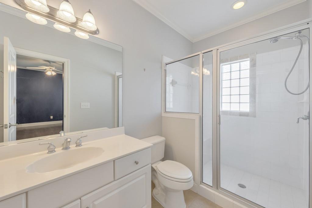 3901 Hazelhurst Drive Northeast Marietta, GA 30066 - Photo 38 of 79 a bathroom with a sink toilet a mirror and shower