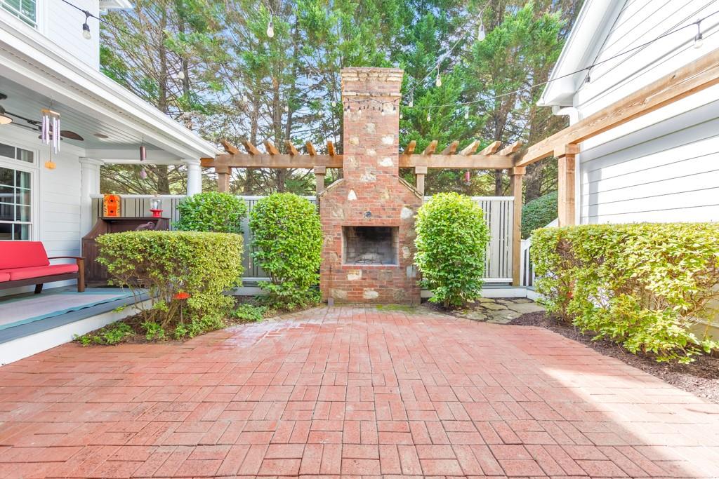 3901 Hazelhurst Drive Northeast Marietta, GA 30066 - Photo 4 of 79 a front view of a house with garden