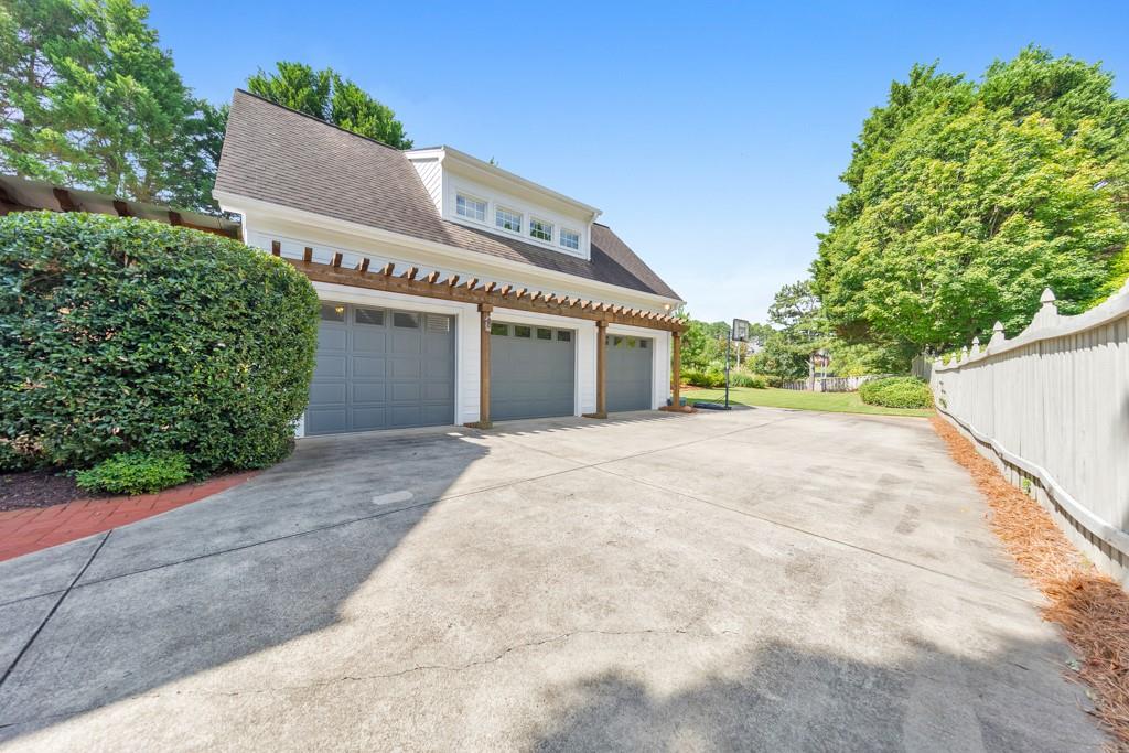 3901 Hazelhurst Drive Northeast Marietta, GA 30066 - Photo 57 of 79 a view of a house with a yard and potted plants