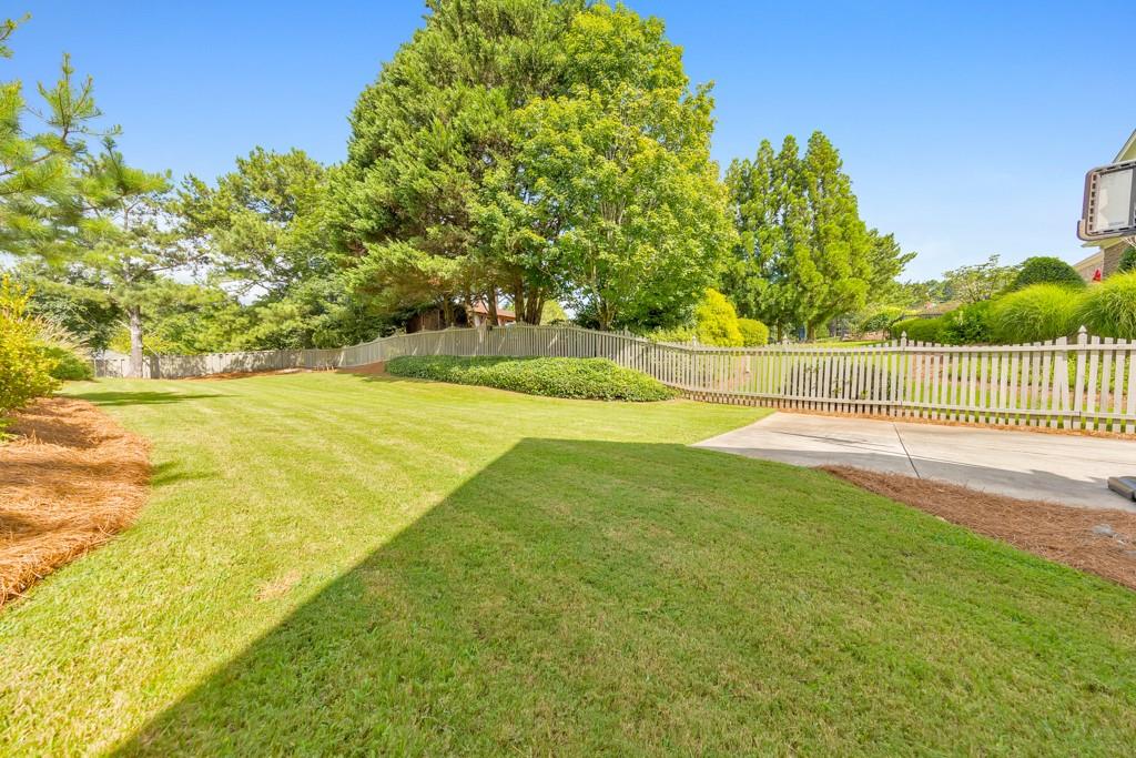 3901 Hazelhurst Drive Northeast Marietta, GA 30066 - Photo 65 of 79 a view of yard with swimming pool and green space