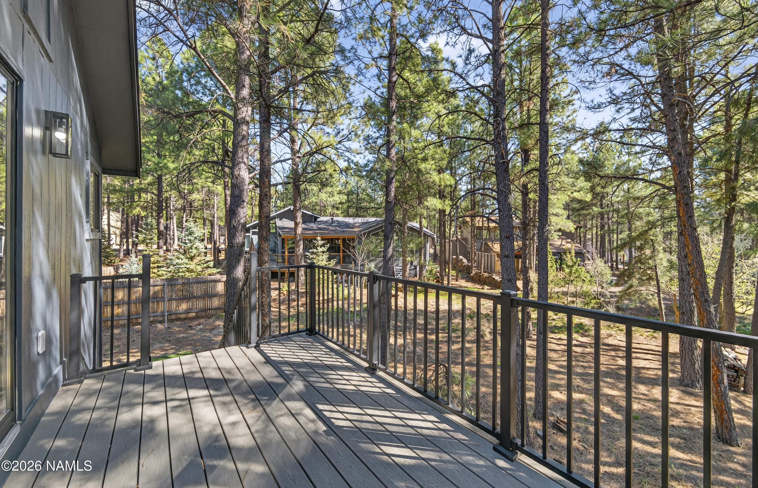 1411 Inverrary Way Flagstaff, AZ 86004 - Photo 13 of 49 a view of a porch with wooden floor and outdoor space