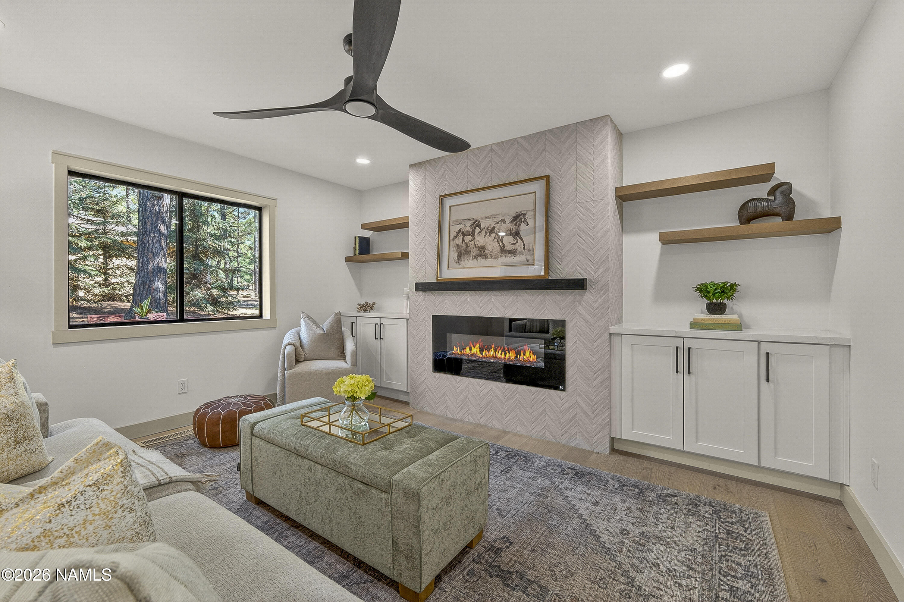 1411 Inverrary Way Flagstaff, AZ 86004 - Photo 14 of 49 a living room with furniture and a fireplace