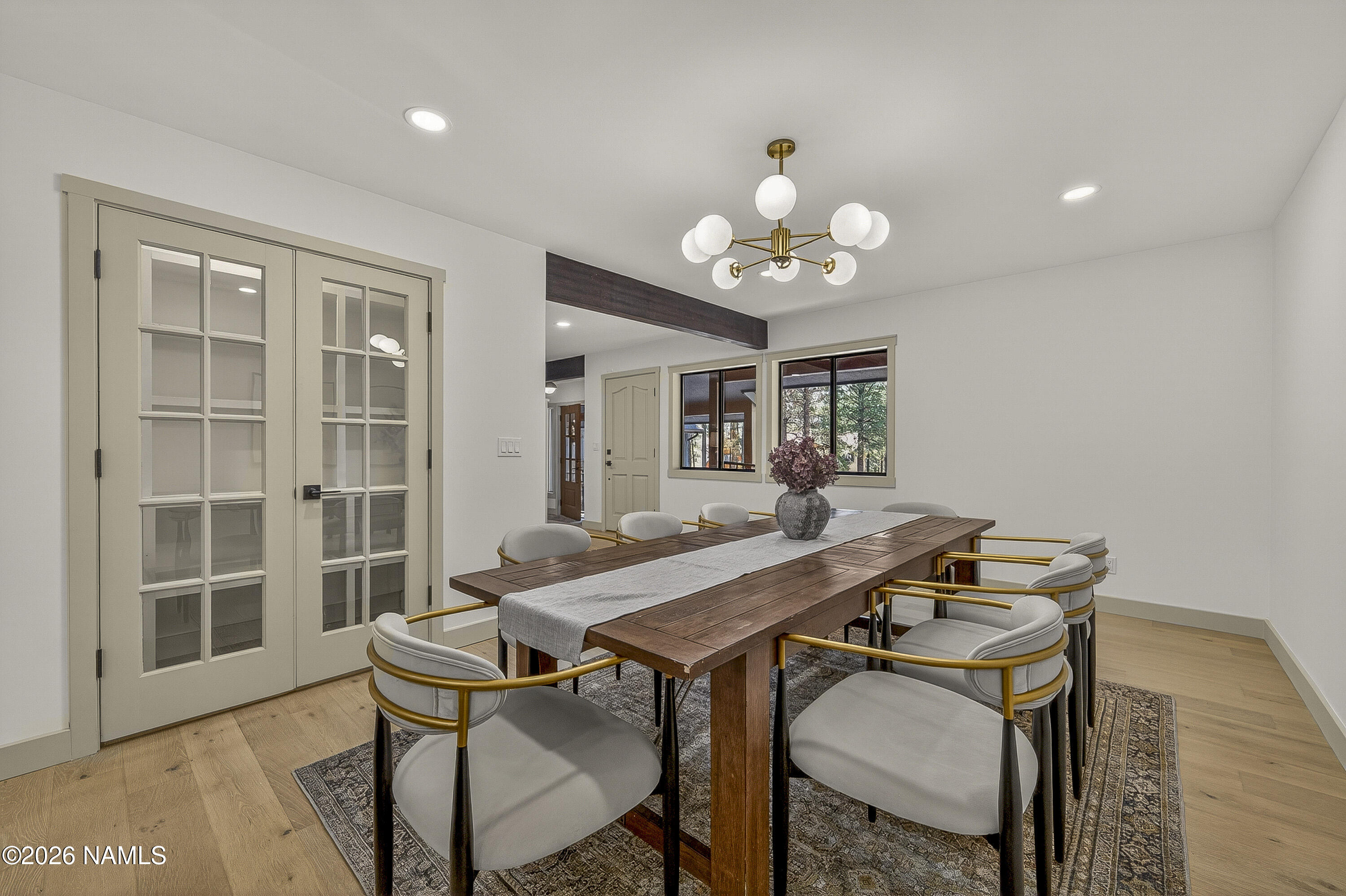 1411 Inverrary Way Flagstaff, AZ 86004 - Photo 20 of 49 a view of a dining room with furniture and wooden floor
