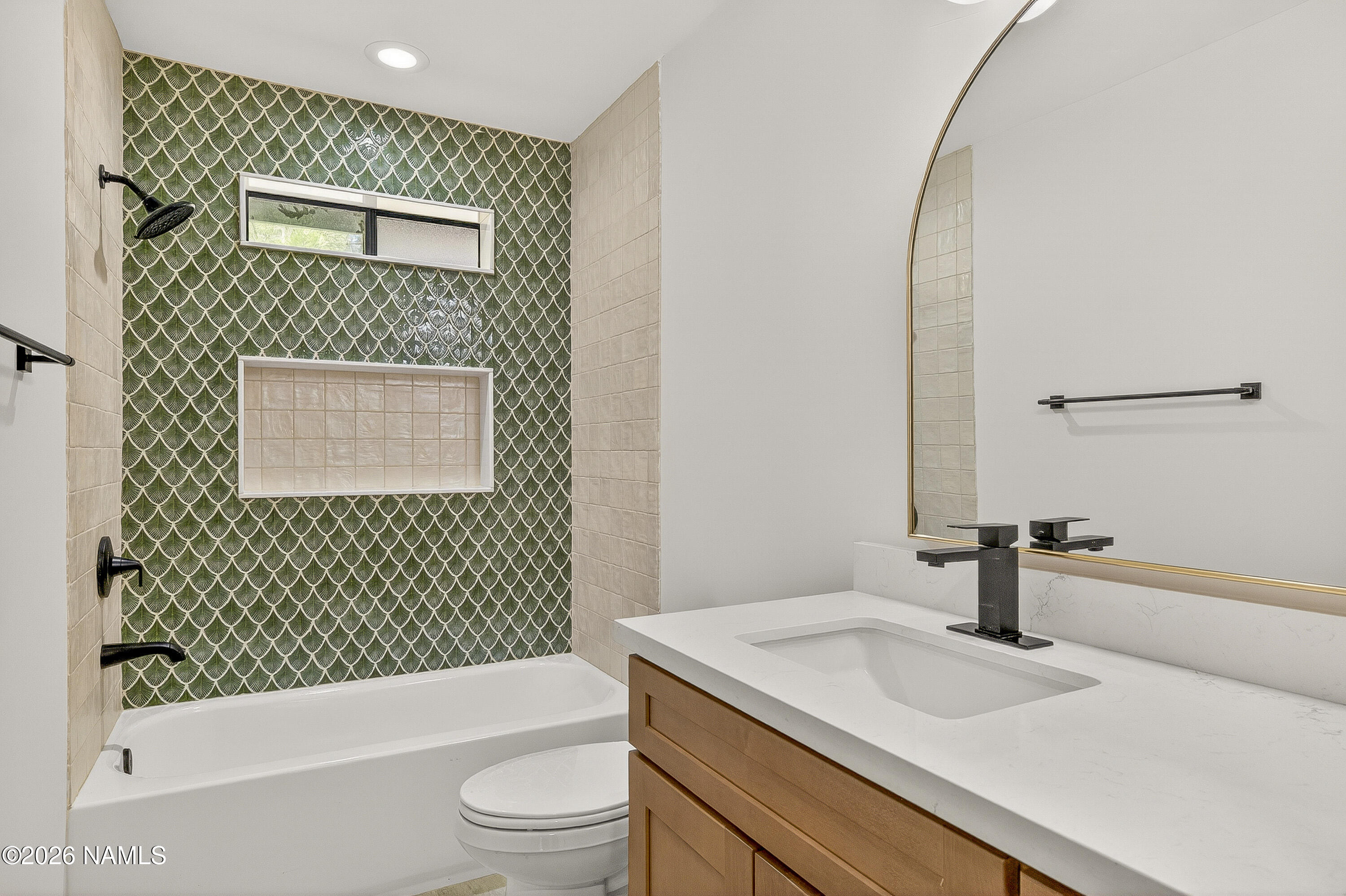 1411 Inverrary Way Flagstaff, AZ 86004 - Photo 39 of 49 a bathroom with a sink a toilet and shower
